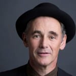 a picture of Mark Rylance smiling for this professional photo shoot